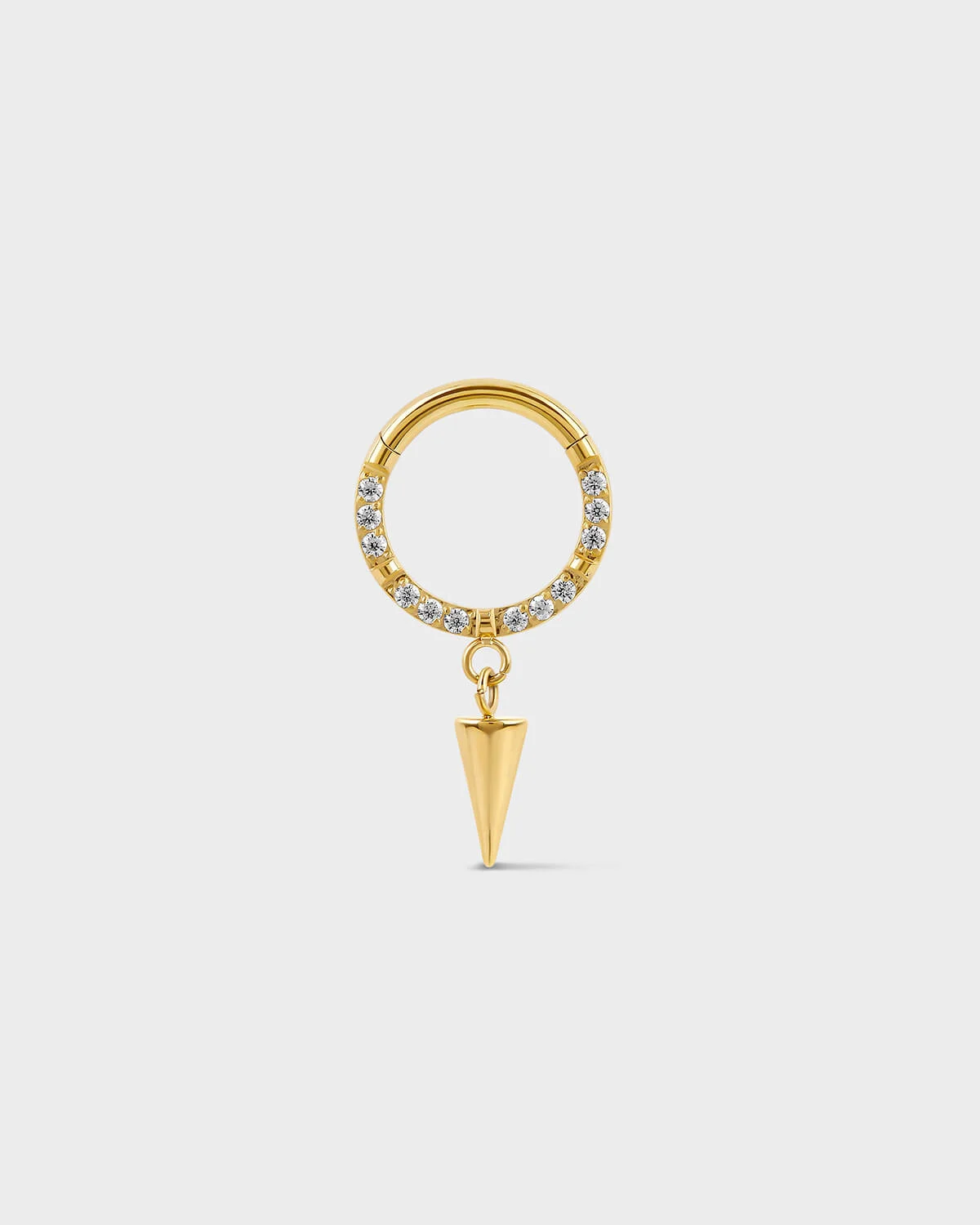 Semi pave gold titanium daith septum ring with dangle cone charm on a ligh gray background