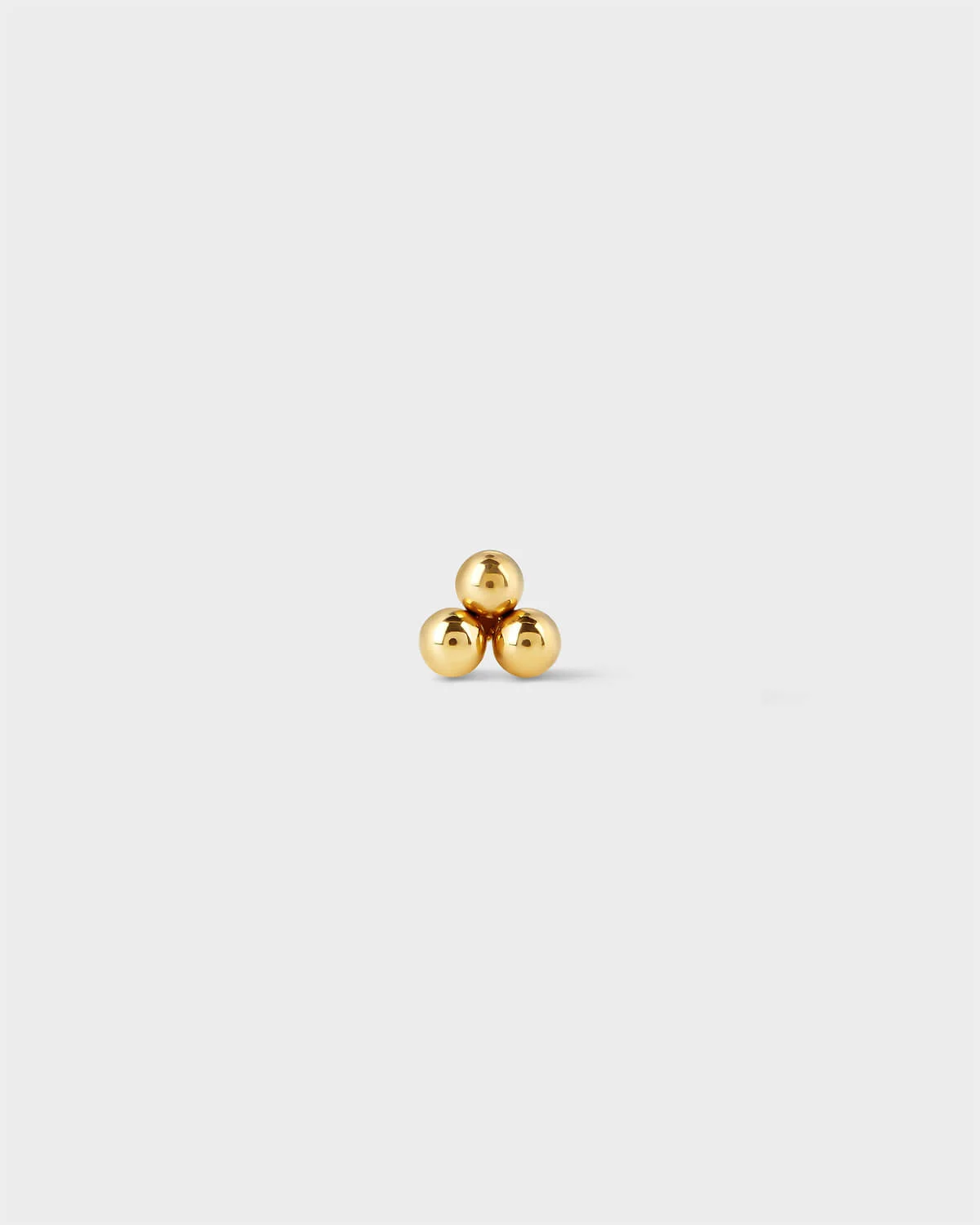 Titanium threadless end featuring a polished three-bead cluster in a minimal triangular arrangement.