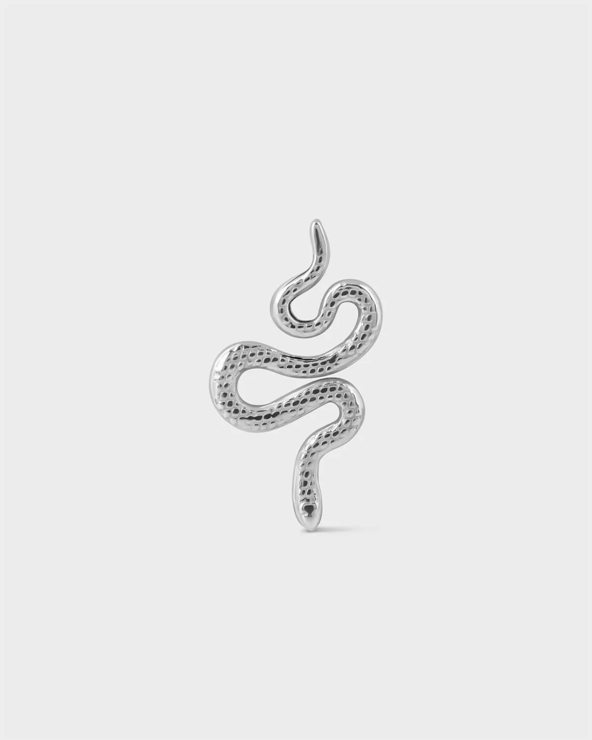 Polished titanium textured snake earring on a light grey background.