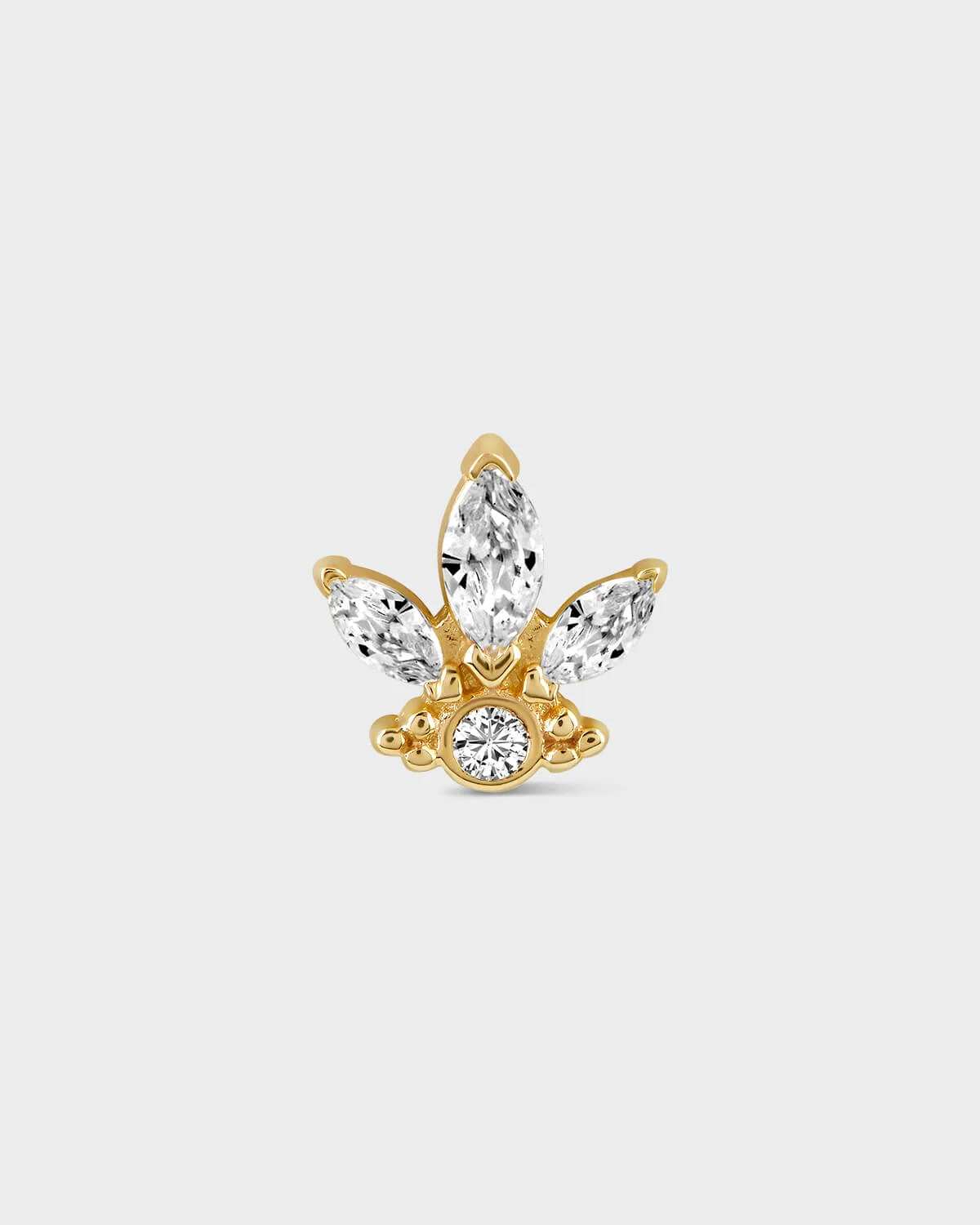 Gold butterfly-shaped earring with clear gemstones on a light gray background