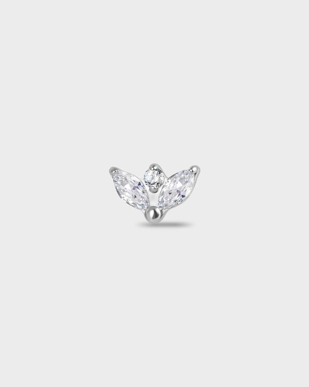 Polished silver Titanium earring with two marquise-cut clear stones set below a single round-cut clear stone on a light gray background.