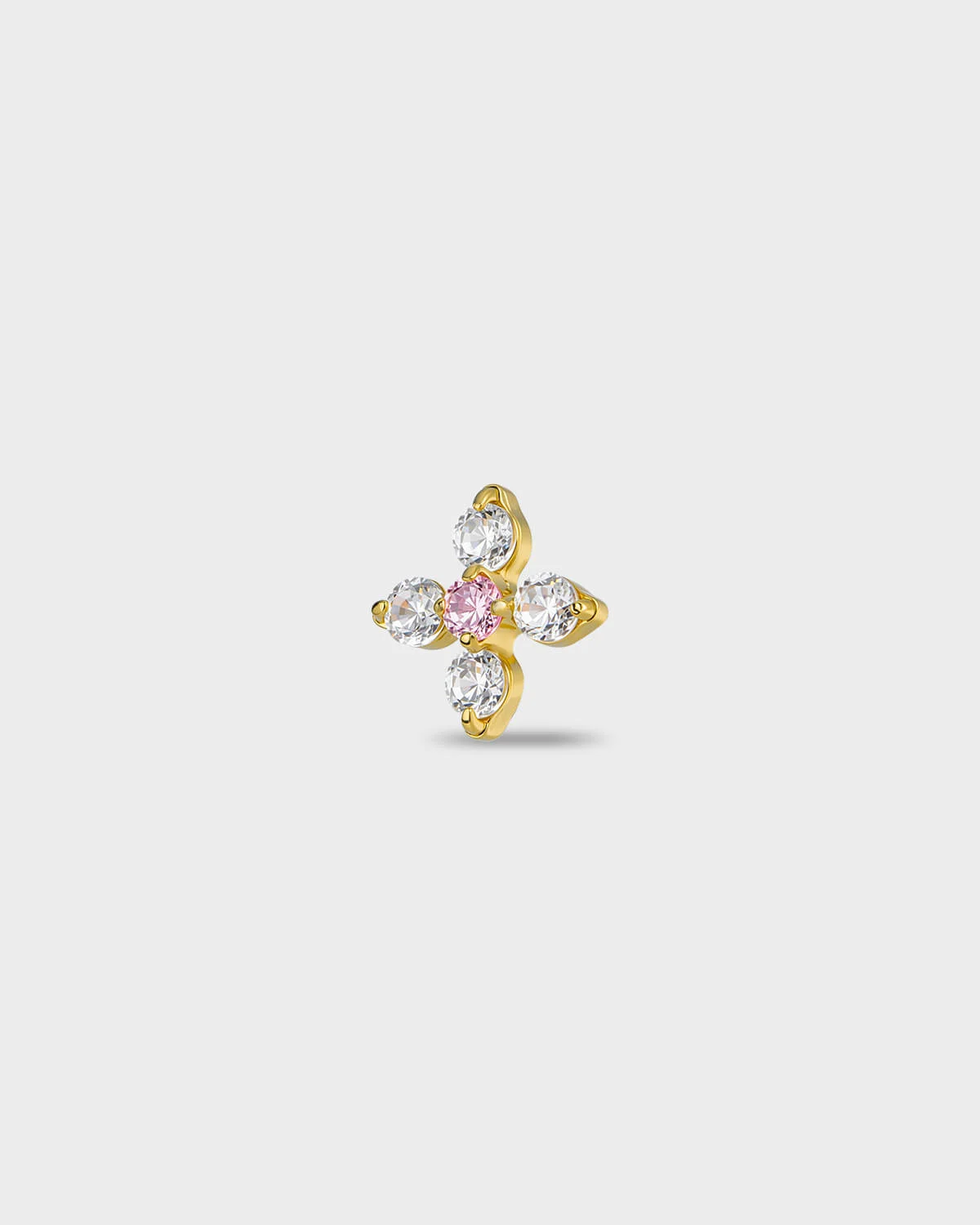 Gold titanium earring with four round-cut clear stones set around a single round-cut pale pink stone, on a light gray background.
