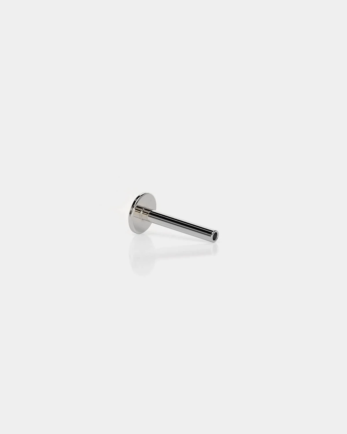 Threadless titanium labret back in polished silver with a 4mm base and 16g shaft on a light gray background