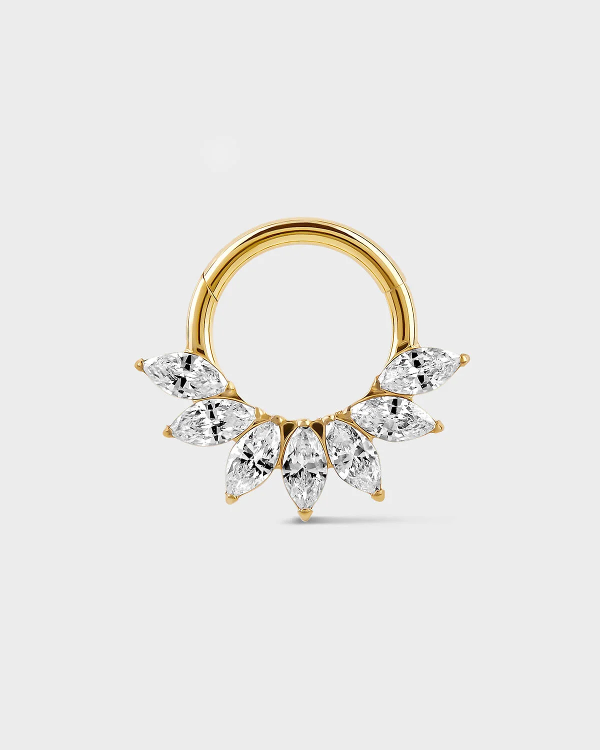 Daith Septum ring in gold titanium with seven marquise gemstone in a fan formation on a light gray background