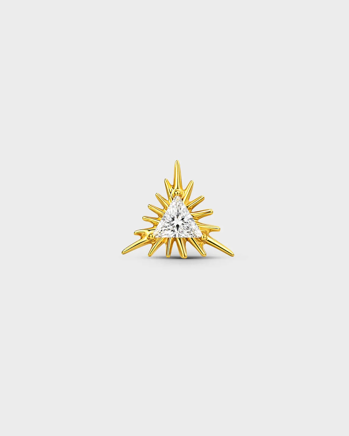 Gold titanium threadless end earring with a trillion-cut clear stone set within a sculpted sunburst design