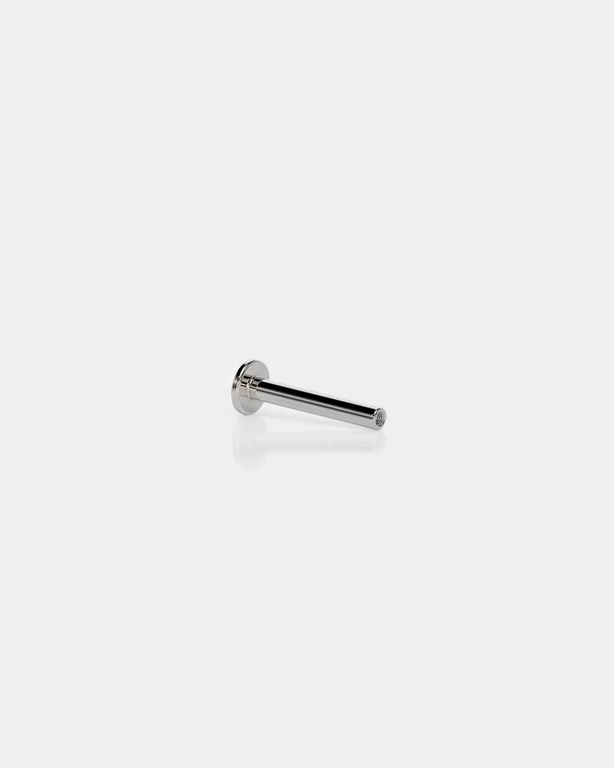 Internally threaded titanium labret back in polished silver with a 3mm base and 16g shaft on a light gray background