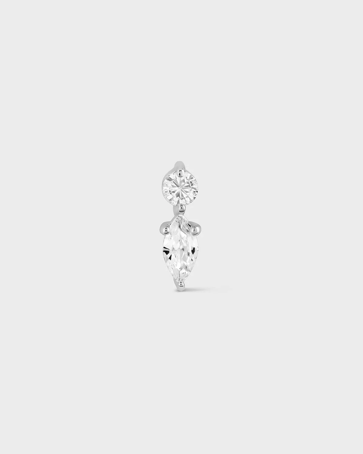 Diamond earring on a light gray background