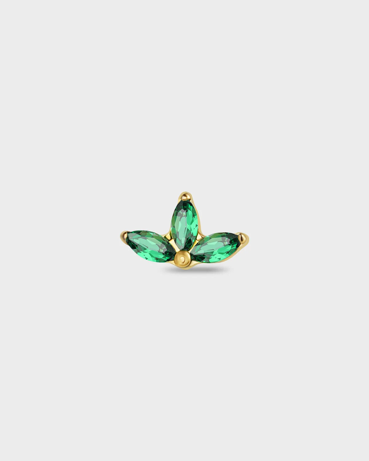 Gold titanium earring with three emerald green marquise gemstones on a light gray background