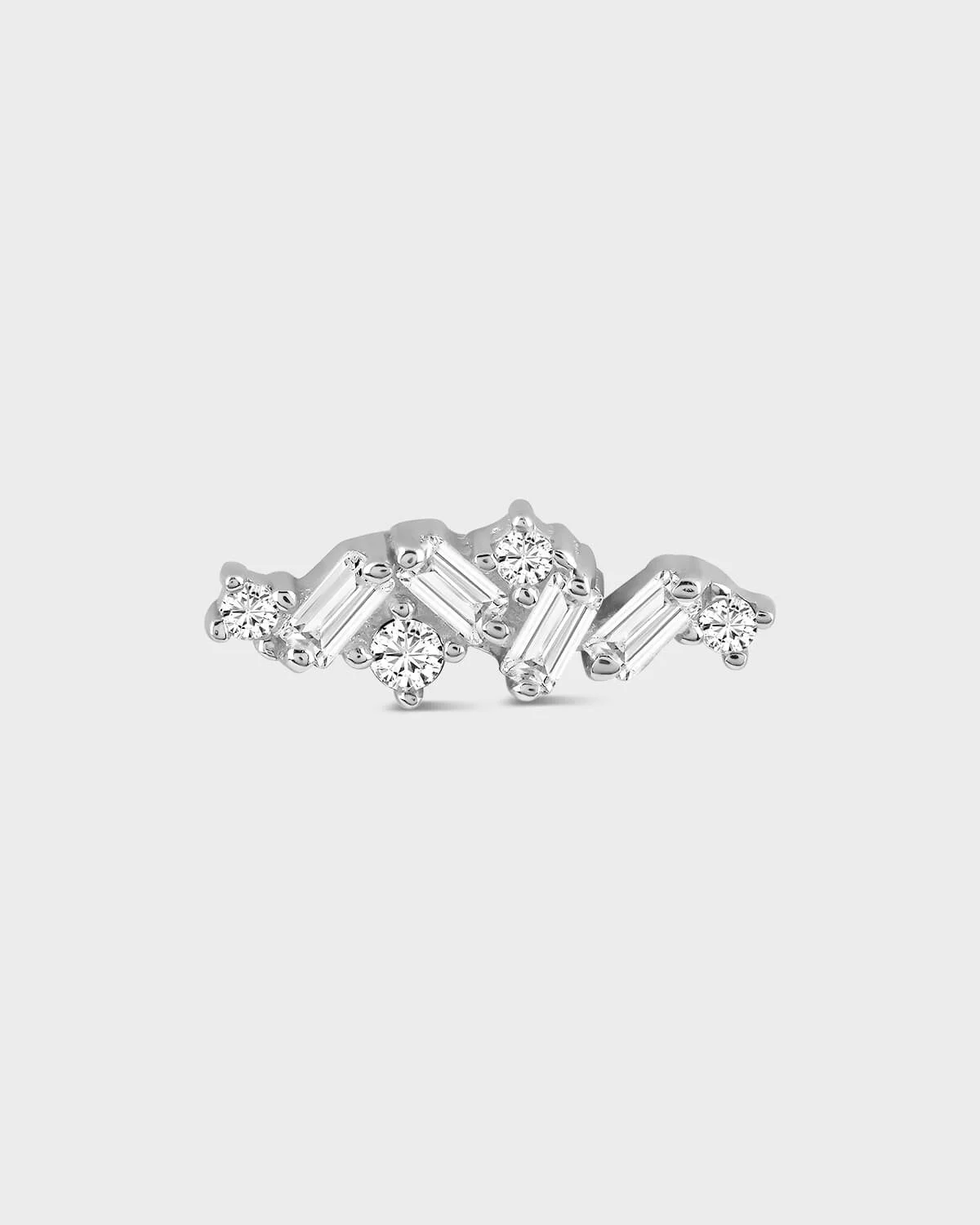 Diamond earring on a light gray background