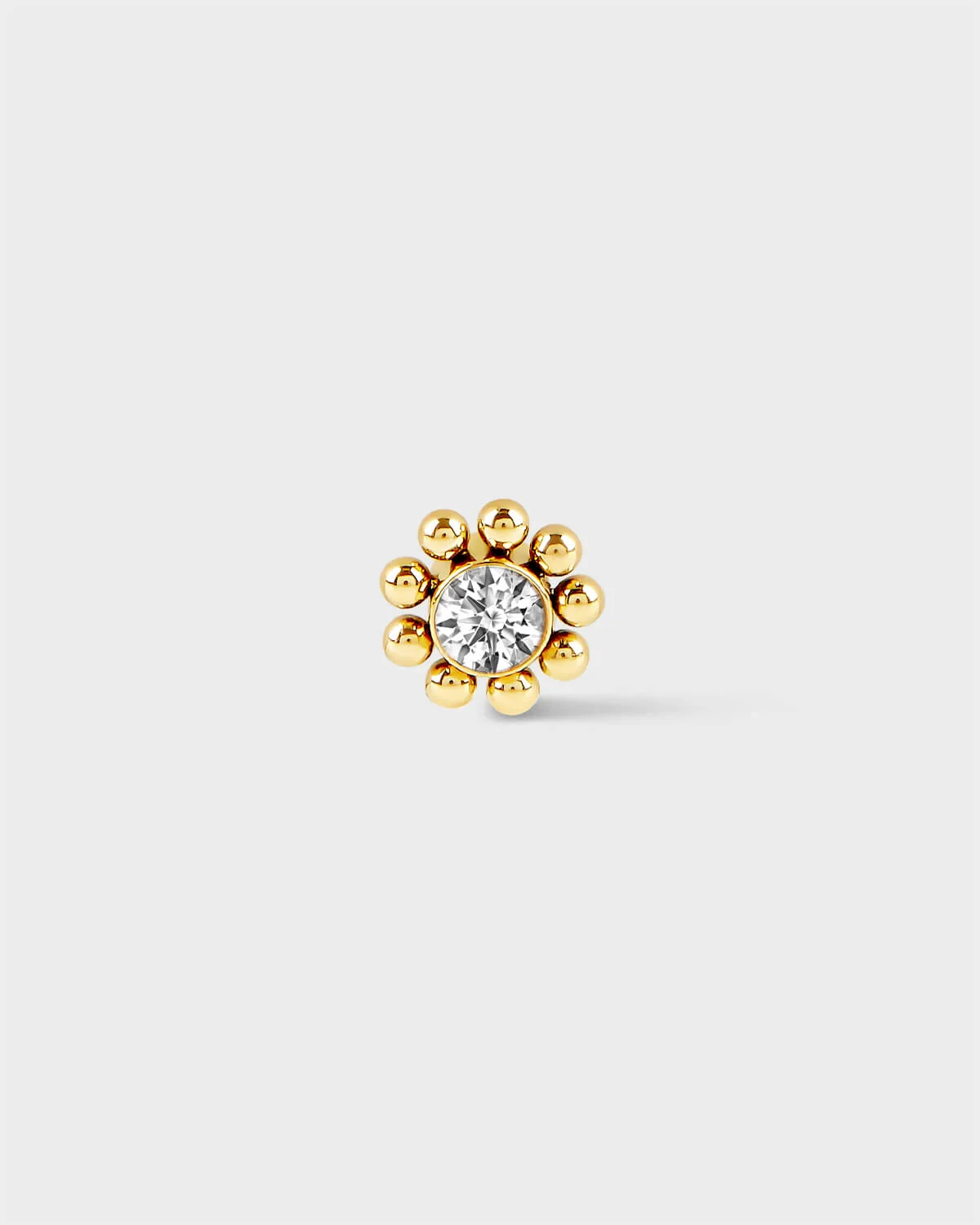 Gold titanium Full beaded solitaire earring on light grey background
