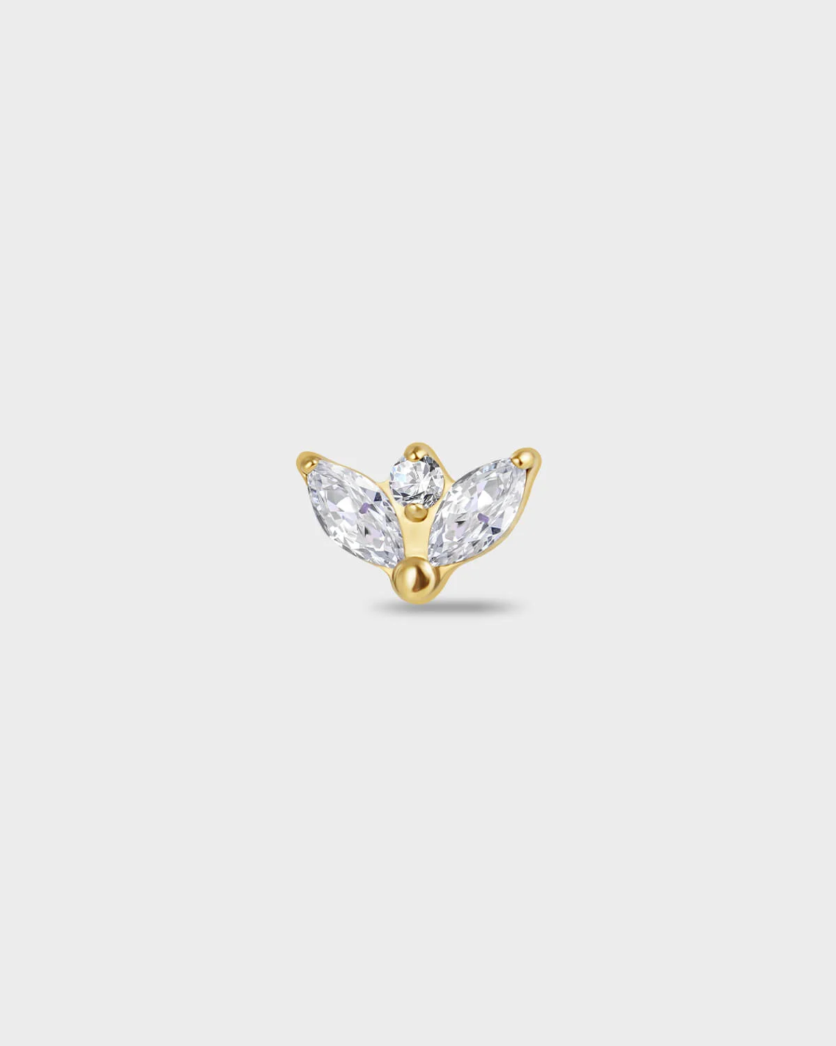 Gold itanium earring with two marquise-cut clear stones set below a single round-cut clear stone on a light gray background.