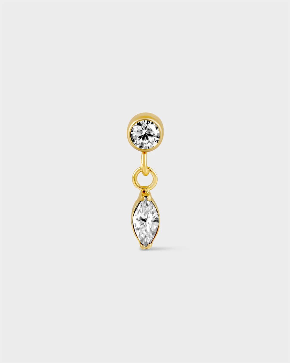 Gold titanium solitaire earring with marquise drop on a light grey background.